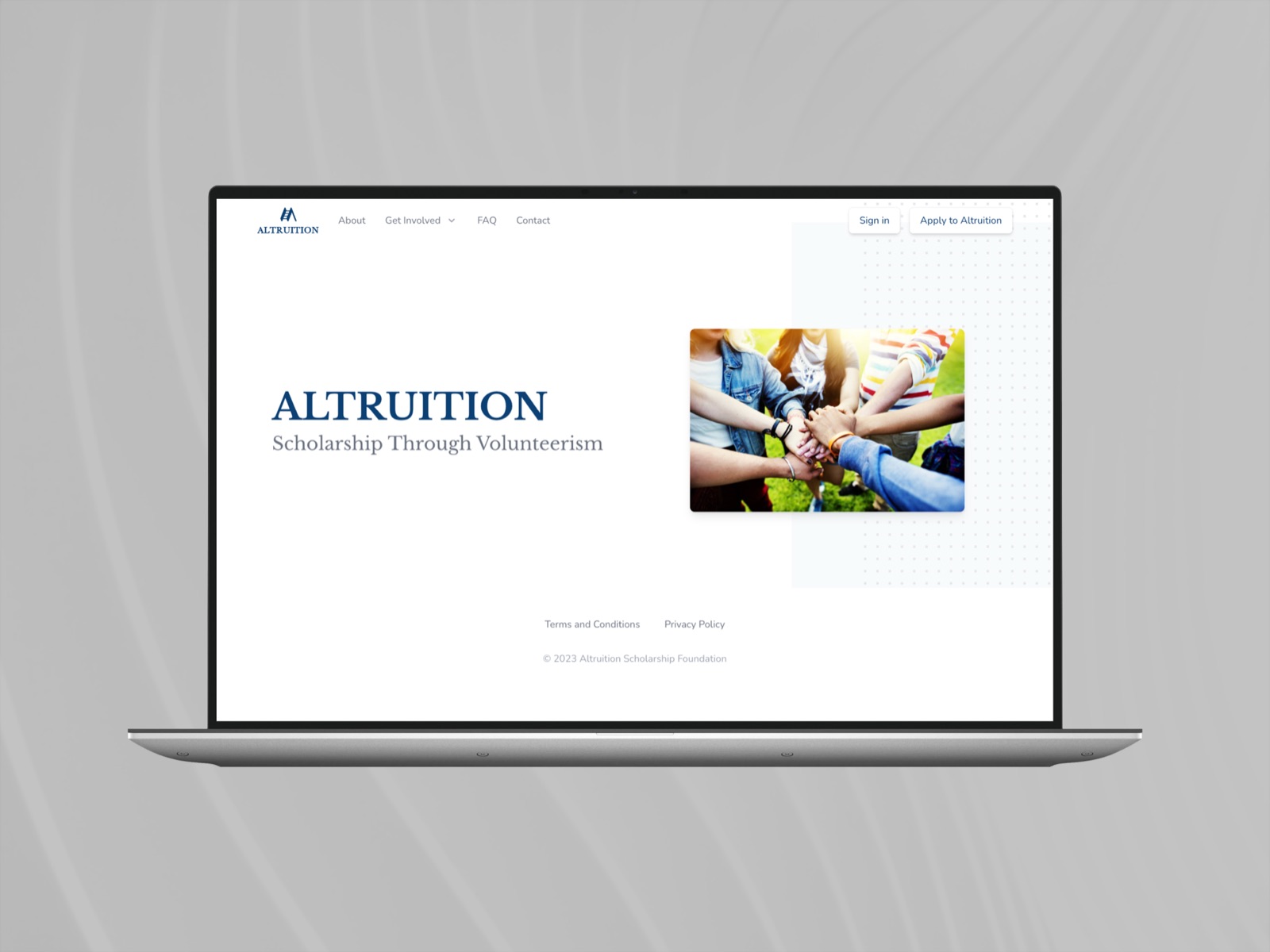 The Altruition home page on a laptop